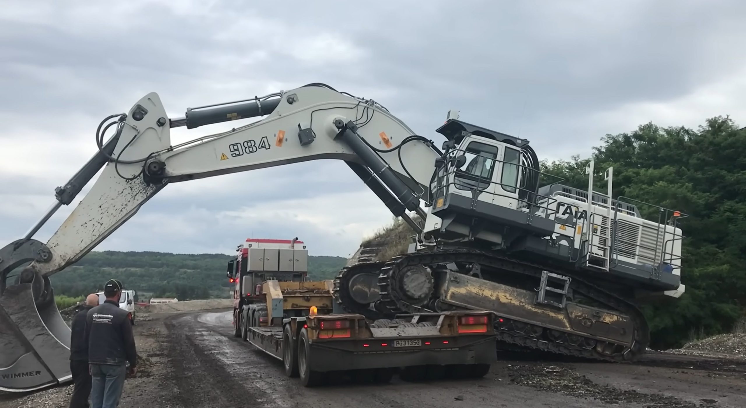 Loading excavator on truck