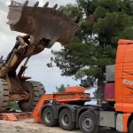 Loading Caterpillar 992G Wheel Loader on trailer