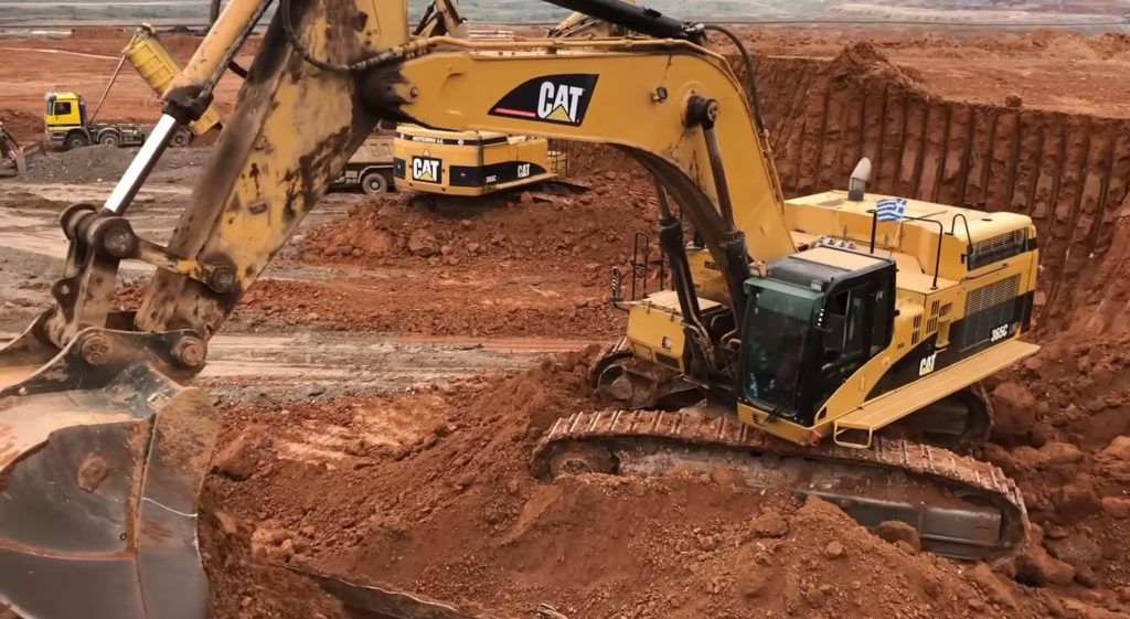 Caterpillar excavator digging earth