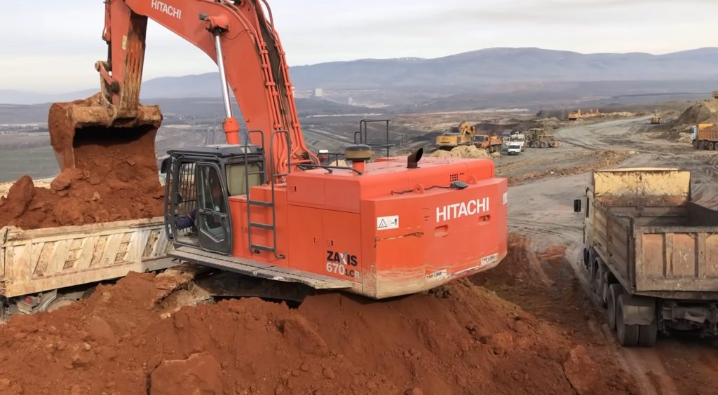 Hitachi Zaxis 670LCR Excavator Loading Trucks