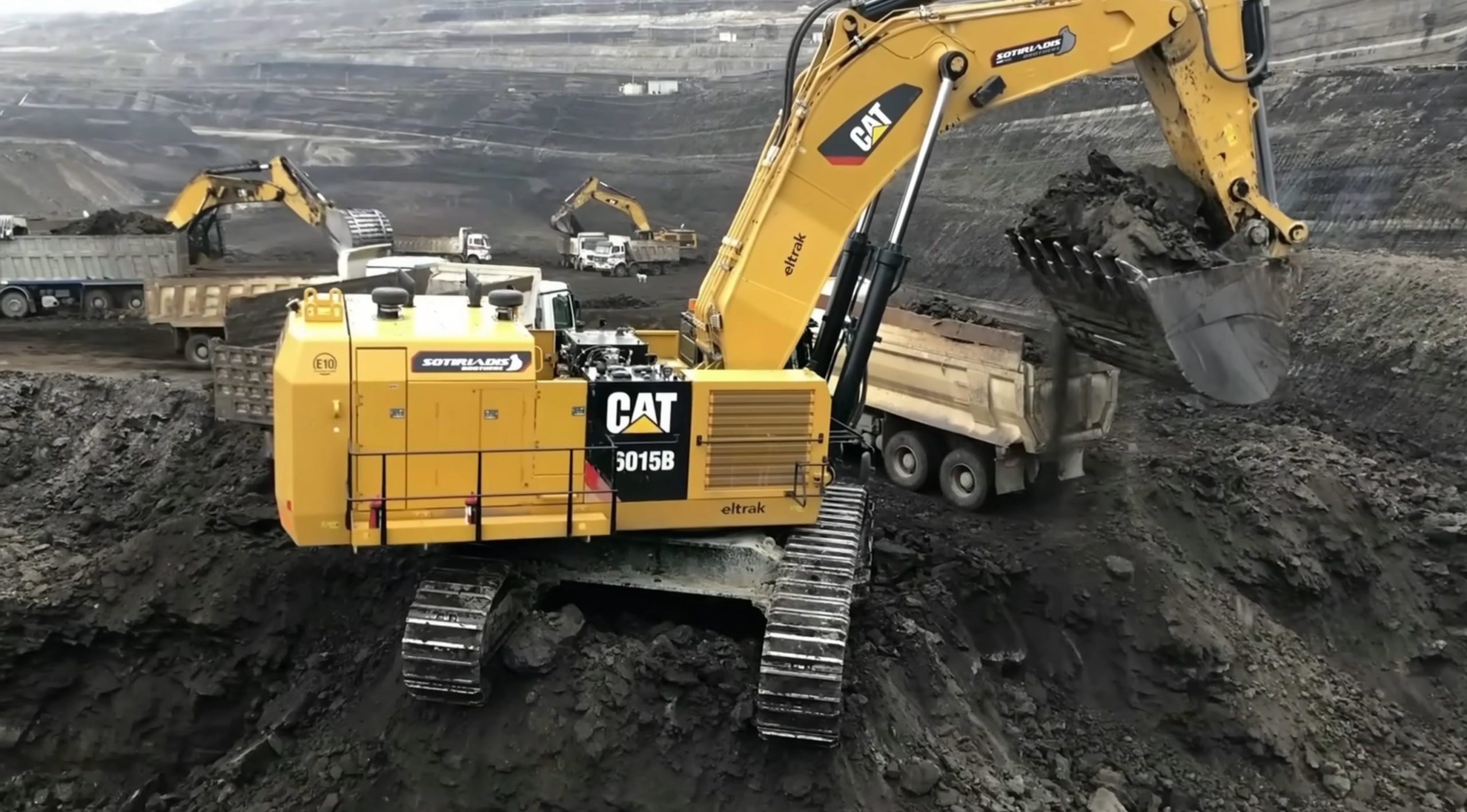 Excavator loading coal on truck