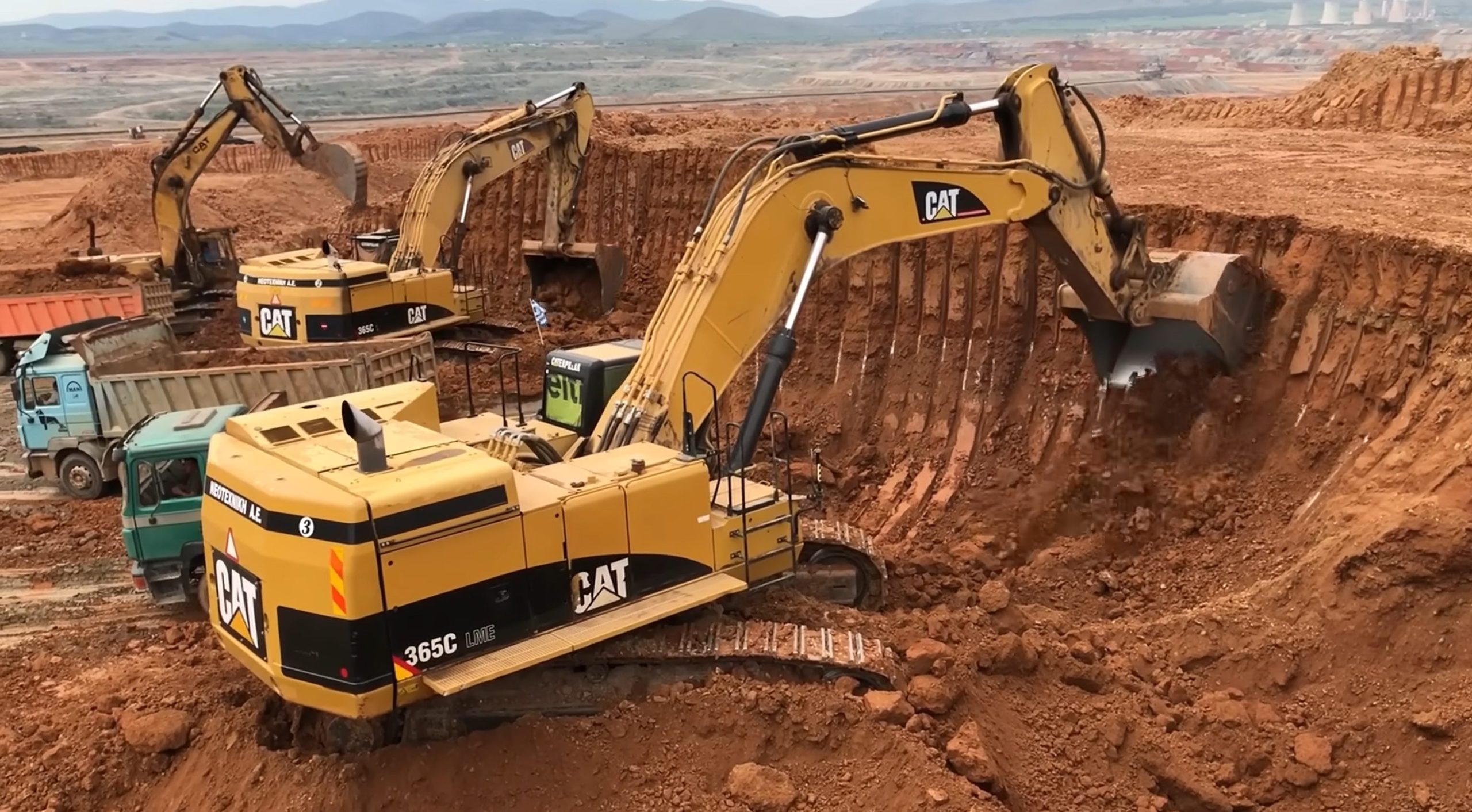 Caterpillar 365C Excavator Loading Trucks