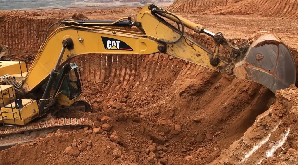 Caterpillar 365C Excavator Loading Trucks