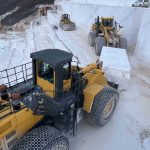 Komatsu wheel loaders transfering exrtacted marble block at marble quarry