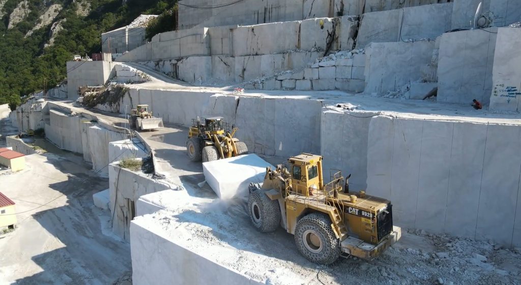 Wheel loaders transporting marble block