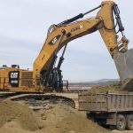 Caterpillar 6015B Excavator Loading Trucks